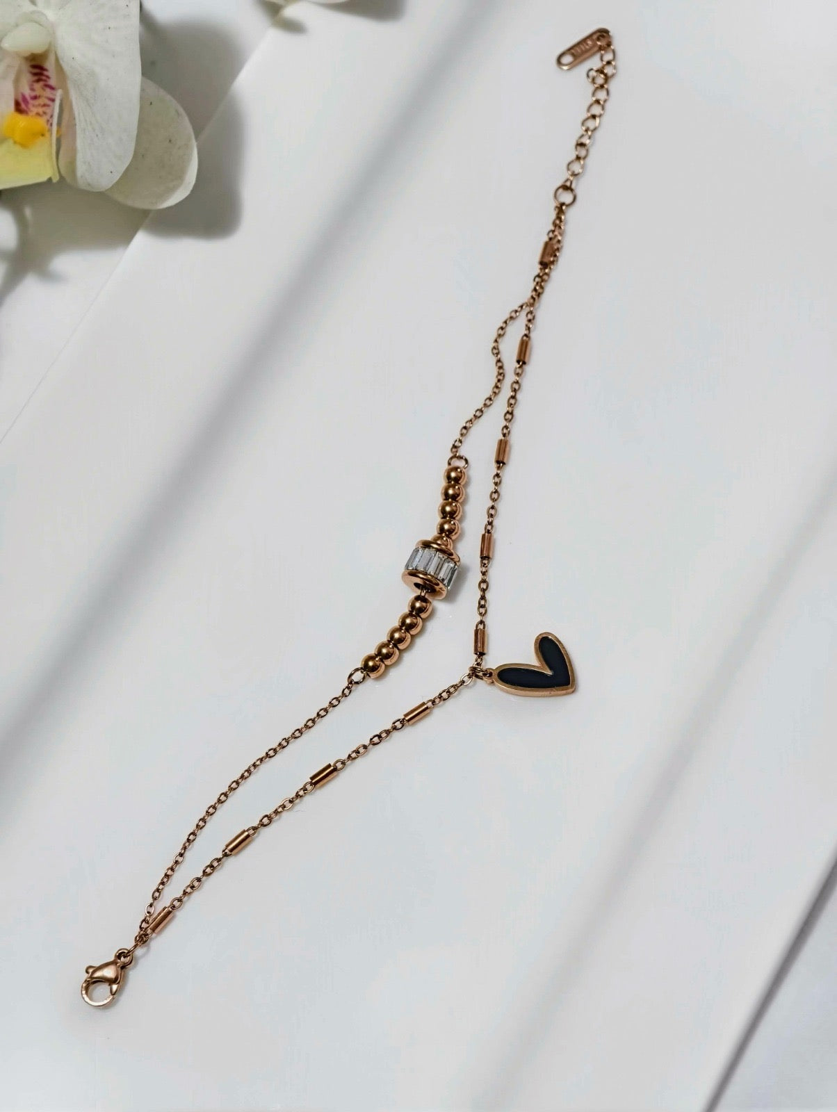 Affordable gold bracelet for girls by ELL DESIGNS featuring a delicate chain and heart charm